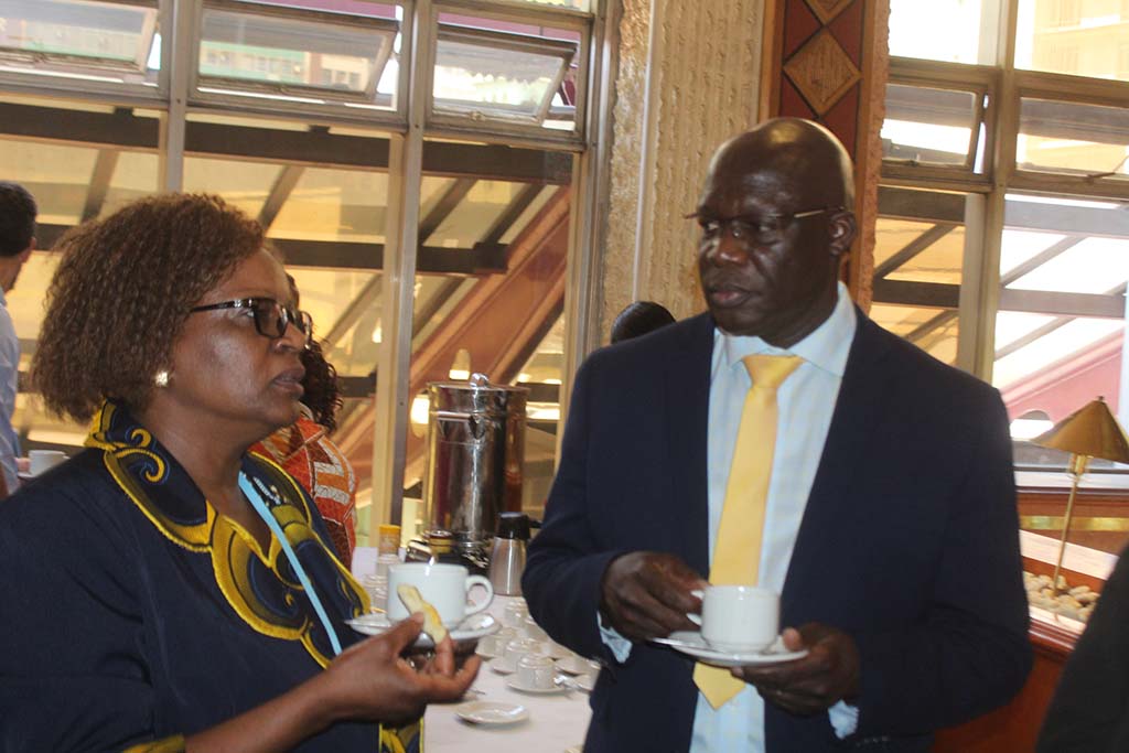 Dr Gwinji discussing with Dr Ndlovu during tea break at the launch of national radiotherapy guidelines