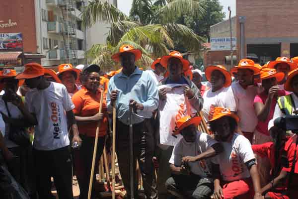 NetOne PR and Marketing Executive Dr Shereni and Clean Up team