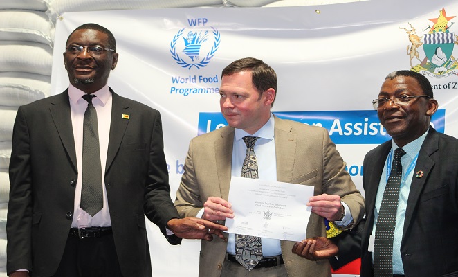 Russian Ambassador (centre) Mr Eddie Rowe (Right) and Mr Erasmus Gapara (left)
