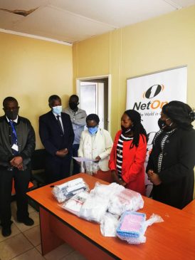 Head Public Relations Dr Eldrette Shereni handing over Taremeredzwa's medical equipment to Dr Mahomva and team at the UZ department of Dentistry and Oral health