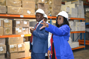 Ms Lynn, NatPharm Masvingo Director, guiding Deputy Minister Kwidini during a tour of the NatPharm warehouse