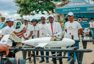 Drone Solutions team in Zimbabwe displaying a medical delivery drone for transporting medicines and blood products