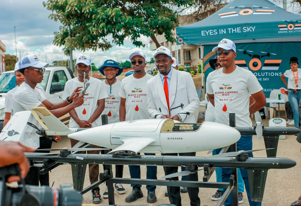 Drone Solutions team in Zimbabwe displaying a medical delivery drone for transporting medicines and blood products