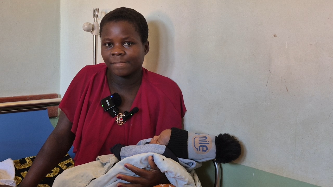Colleta Ngende from Manicaland, Zimbabwe, holding her newborn baby after a safe caesarean delivery at Hauna District Hospital.