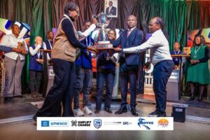 NUST students celebrate after winning the 2026 SayWhat National Universities Quiz Challenge alongside Youth Minister Tinoda Machakaire and SayWhat Executive Director Jimmy Wilford.