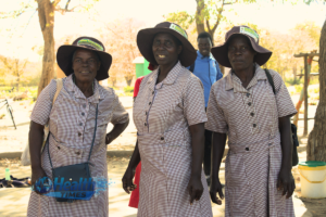 Three village health workers in Gokwe, Zimbabwe supporting community health services and improving access to non-communicable disease care.