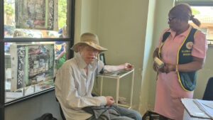 Josam Kuvandi, a person with albinism, speaks about access to skin cancer treatment during a Global Aid Missions outreach in Zimbabwe